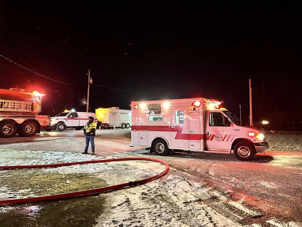 Van Wert CERT response vehicles supporting firefighters at a nighttime winter incident